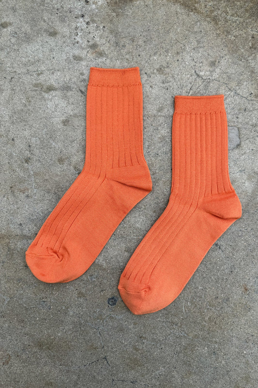 Her Socks in Tangerine